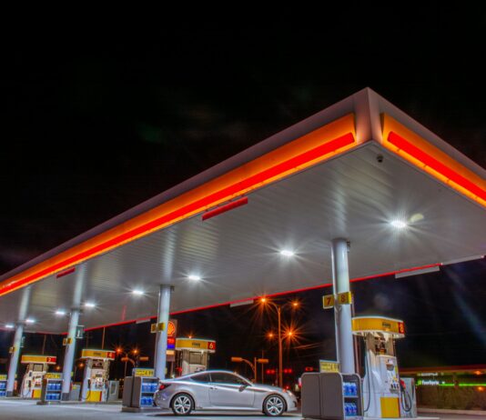 7월부터 유류세 인하율 조정…“석유류 가격 인상 자제해주길” white car parked in front of red and white building during night time