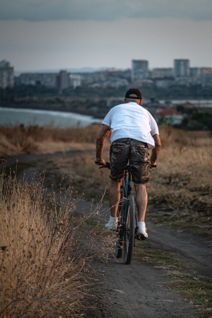 Photo by Dimitar Kazakov man driving the bicycle