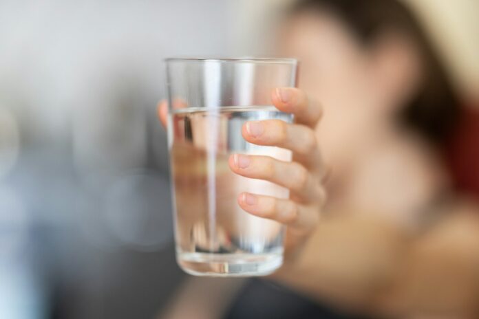 Photo by engin akyurt person holding clear drinking glass