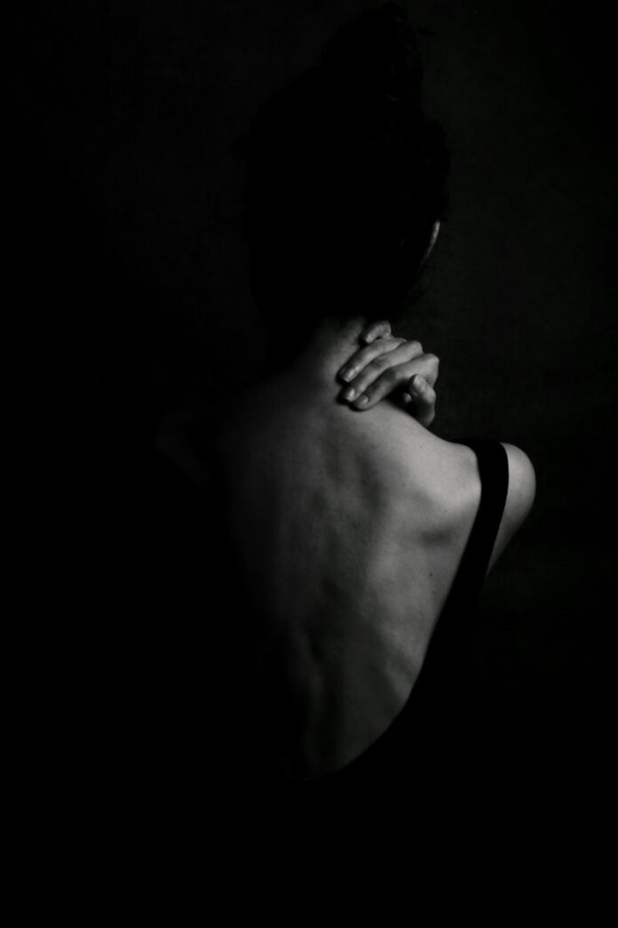 Photo by Hamide Jafari woman in black tank top